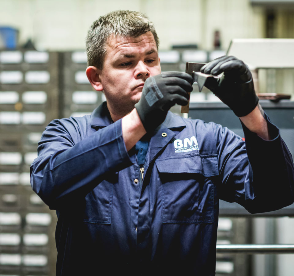 A manufacture is inspecting a product part in a factory