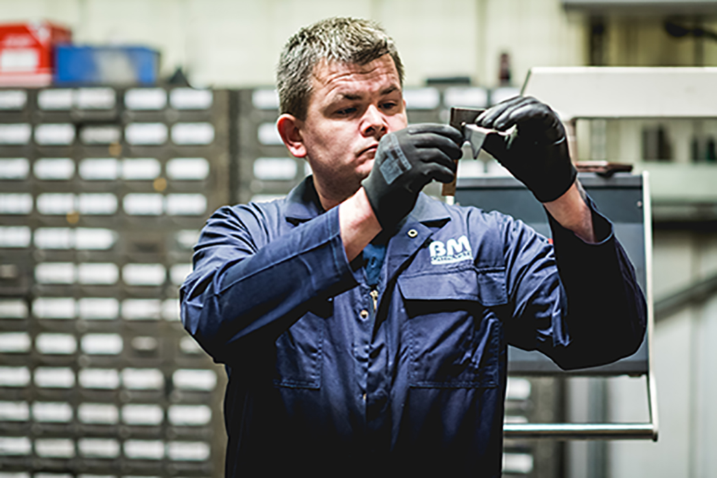 A manufacture is inspecting a product part in a factory